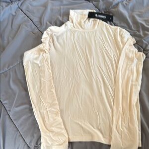 The Lounge High Neck Beige Top Size Medium but fits like a tight small NWT